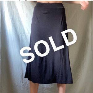 A semi-flared, black, mixi skirt !